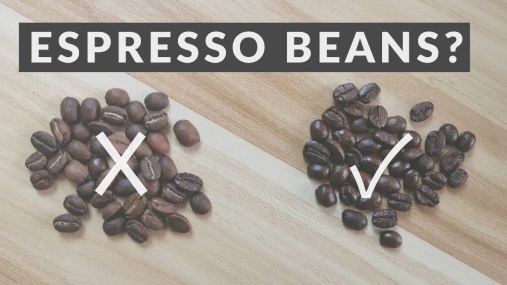 Freshly ground coffee beans beside an espresso portafilter on a modern marble countertop.