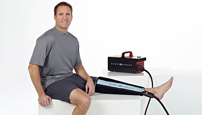 Applying a protective barrier before using the Game Ready wrap for recovery.