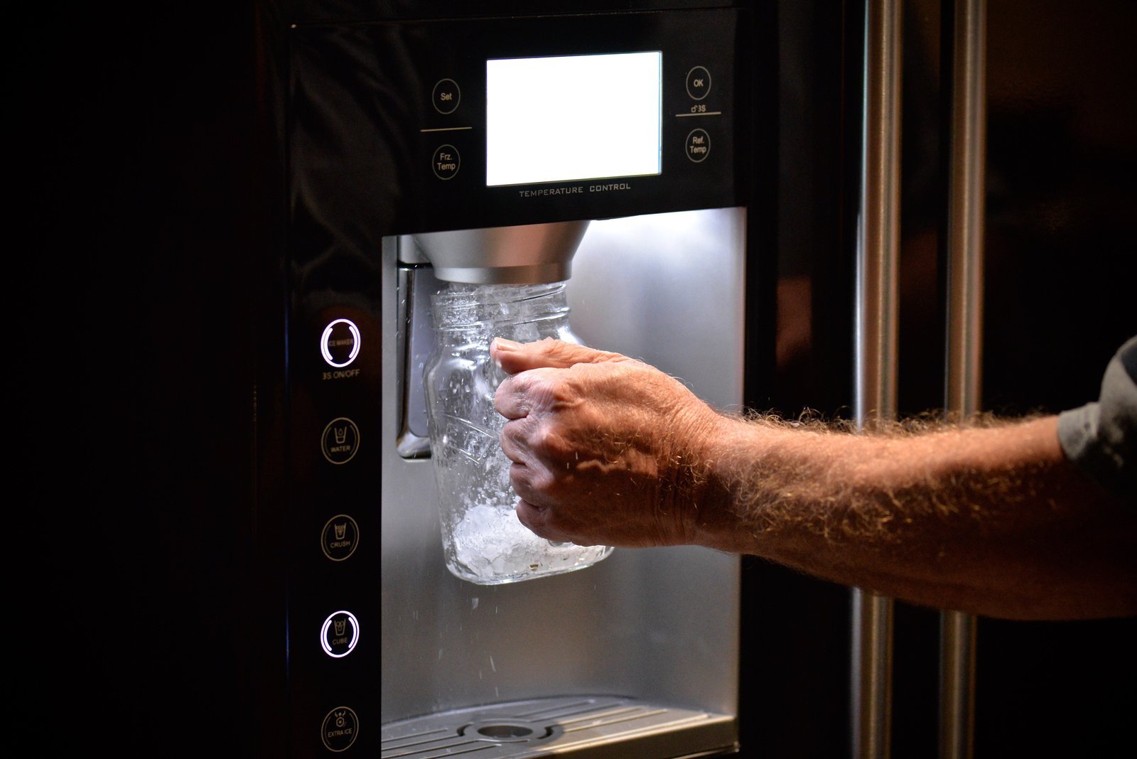 Technical view of the internal components of an undercounter ice maker unit.