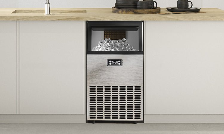 A modern commercial ice machine in a restaurant kitchen representing ice machine lifespan.