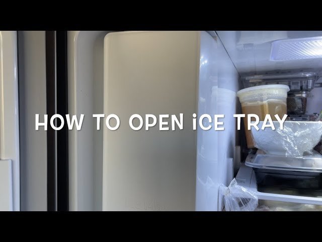 Technician inspecting a modern commercial ice machine in a bright professional kitchen.