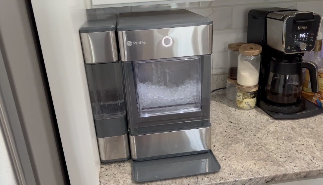Cleaning supplies and tools organized for maintaining a nugget ice maker.