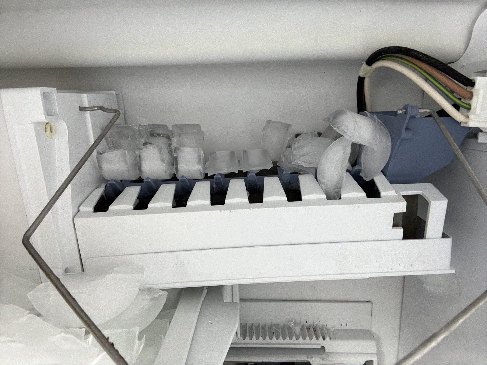 Checking the home electrical circuit breaker to troubleshoot an ice machine.