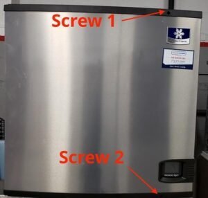 A hand holding a refrigerator power plug to perform a hard reset.