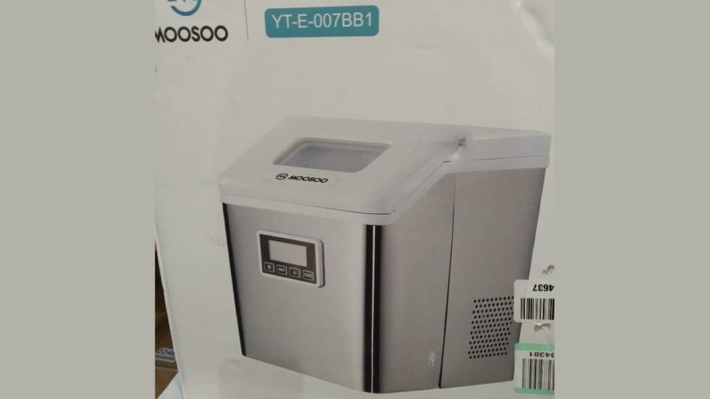 A modern Moosoo ice maker sitting on a clean kitchen countertop with clear ice.