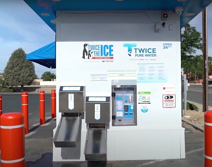 Filling a large plastic jug with purified water from a vending kiosk.