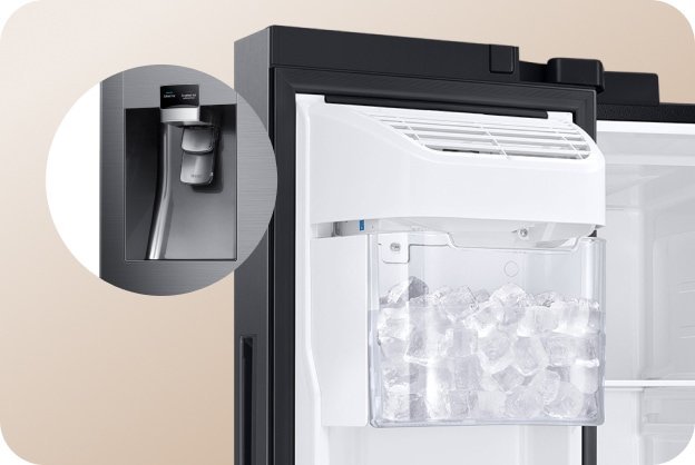 Close-up view of the internal mechanical components of a refrigerator ice maker.