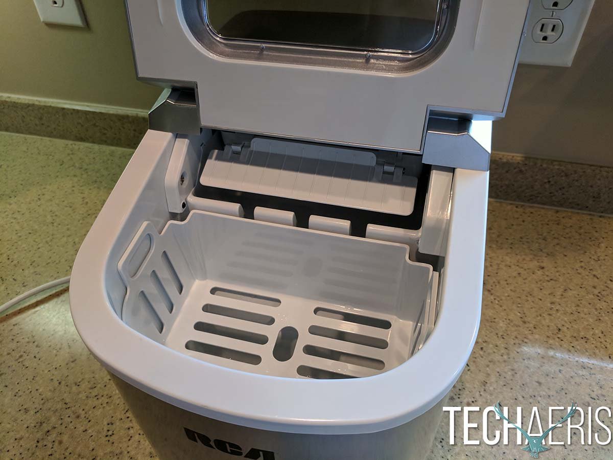 Essential cleaning supplies and water pitcher for operating an RCA ice maker.