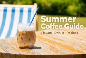 A refreshing glass of iced coffee with caramel swirls on a marble table.