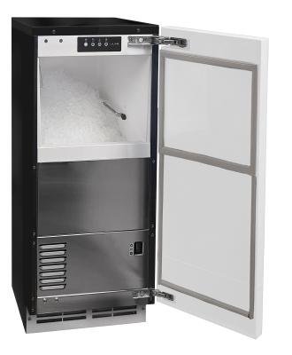 A clean interior view of an under counter ice maker filled with fresh ice.