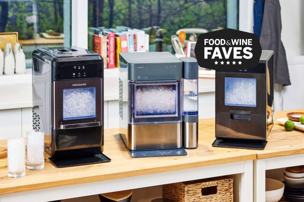 A modern stainless steel ice maker machine displayed in a bright, contemporary kitchen.