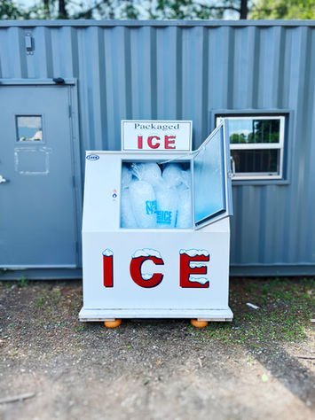 The digital interface of an ice machine shows a green ready light.