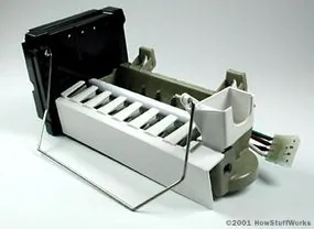 A close-up of an ice maker mold showing the water intake and freezing cycle.