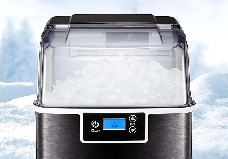 Different types of ice shapes sitting on a counter near an ice machine.