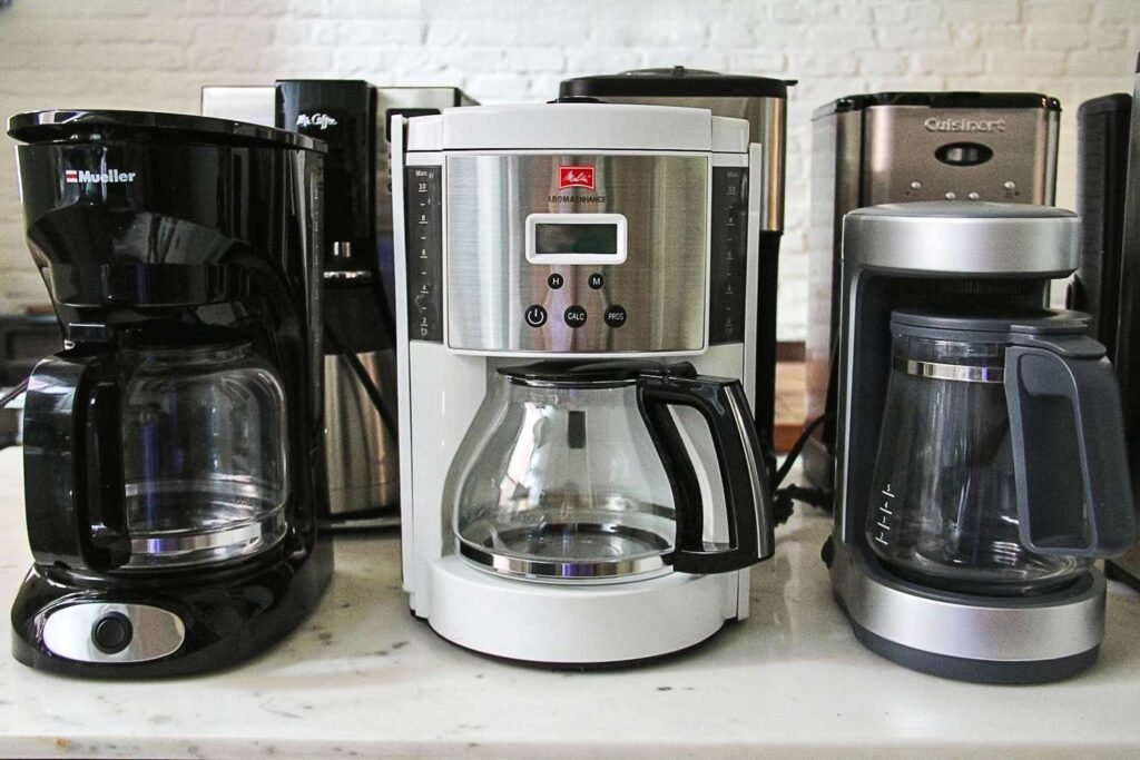 A fresh pot of coffee brewing on a counter to find the best coffee to use for cheap coffee pots.