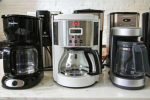 A fresh pot of coffee brewing on a counter to find the best coffee to use for cheap coffee pots.