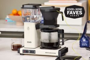 Freshly brewed coffee in a glass carafe on a drip machine.