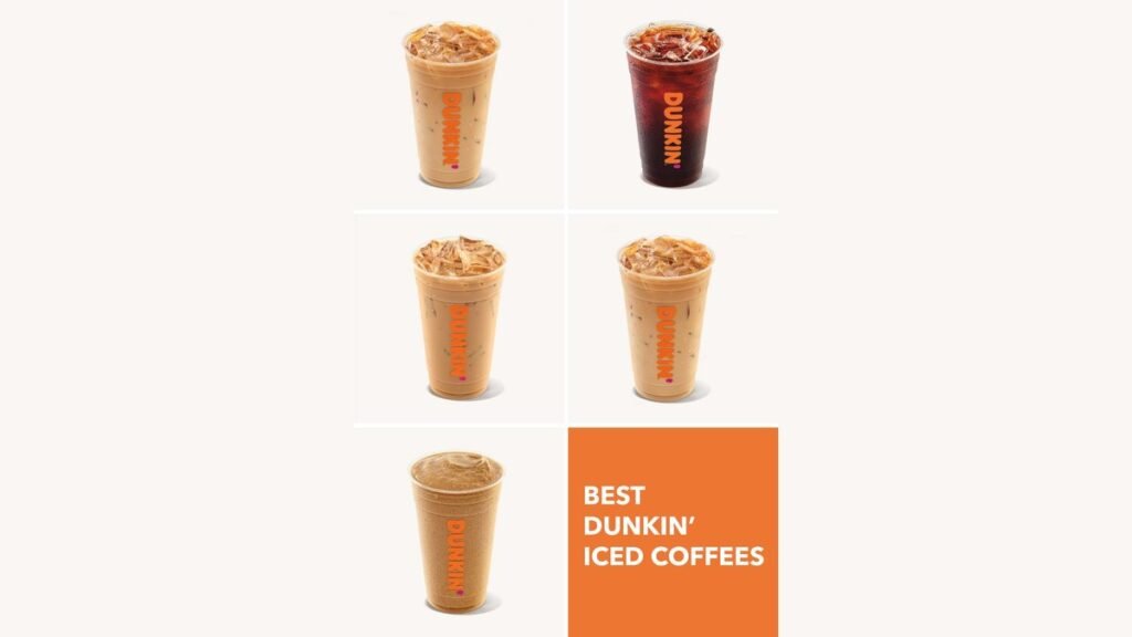 A refreshing glass of iced coffee with swirling milk on a wooden table.