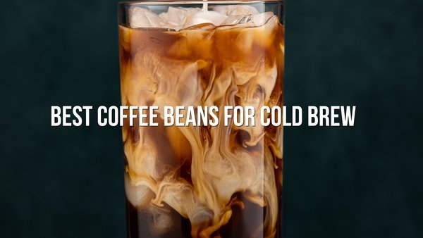 A refreshing iced coffee drink served in a glass on a wooden table.
