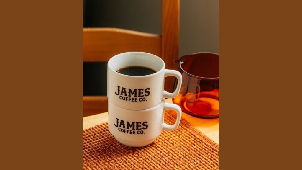 A steaming mug of coffee on a table represents the best coffee spots.